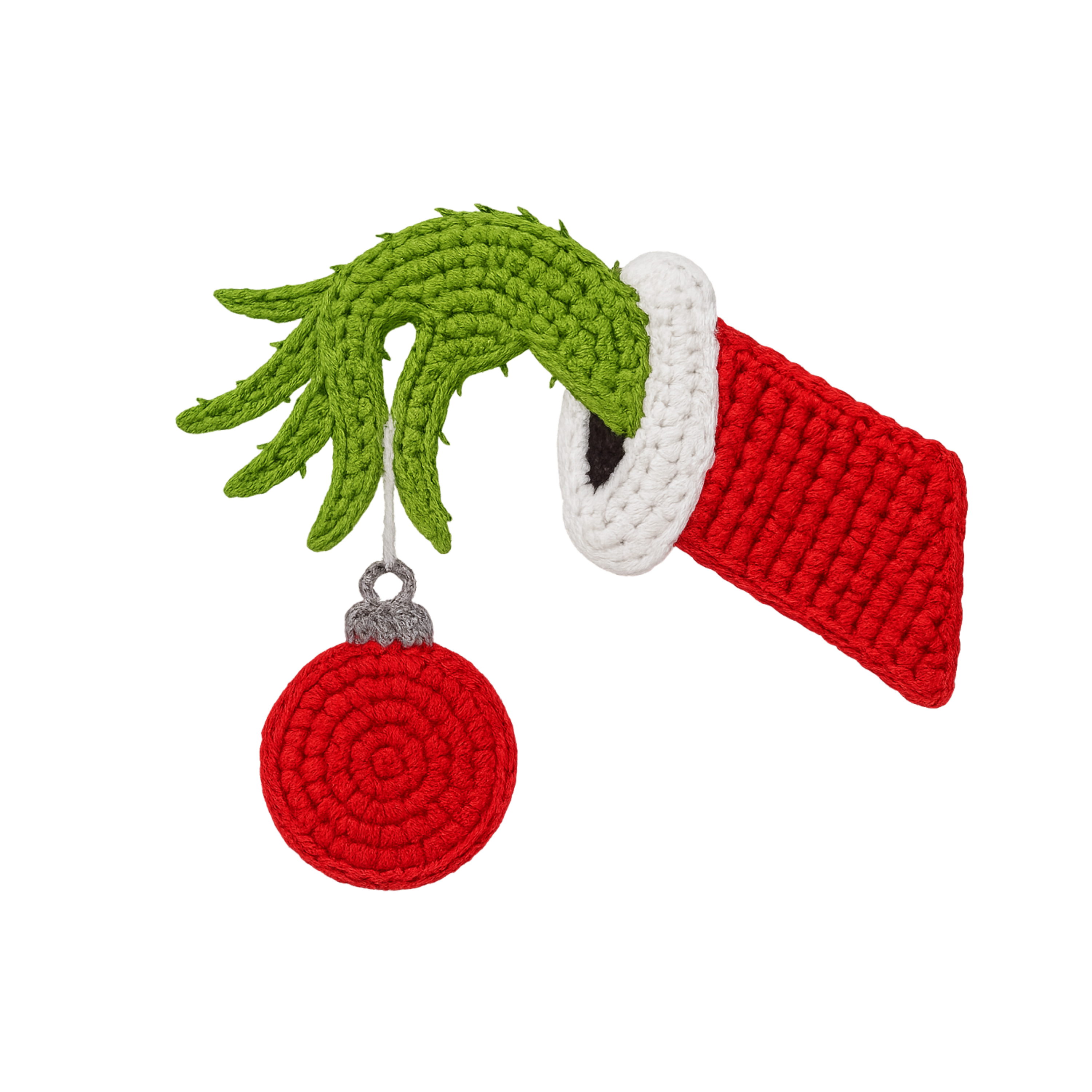 Crocheted Grinch hand holding a ornament on a white background