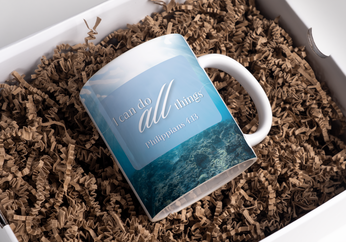 Mug with motivational quote on a bed of brown shredded paper