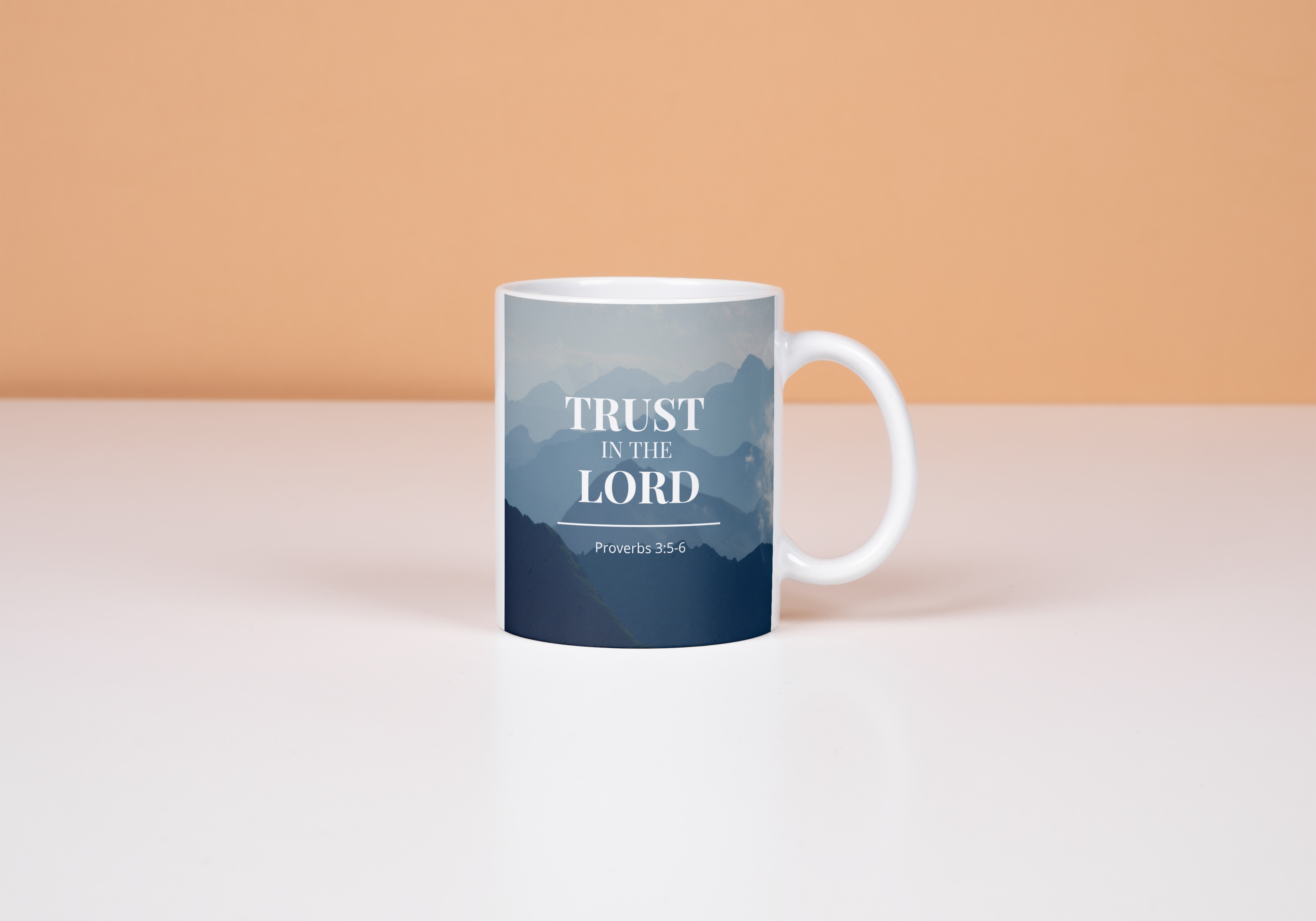 Mug with 'Trust in the Lord' text on a peach and white background
